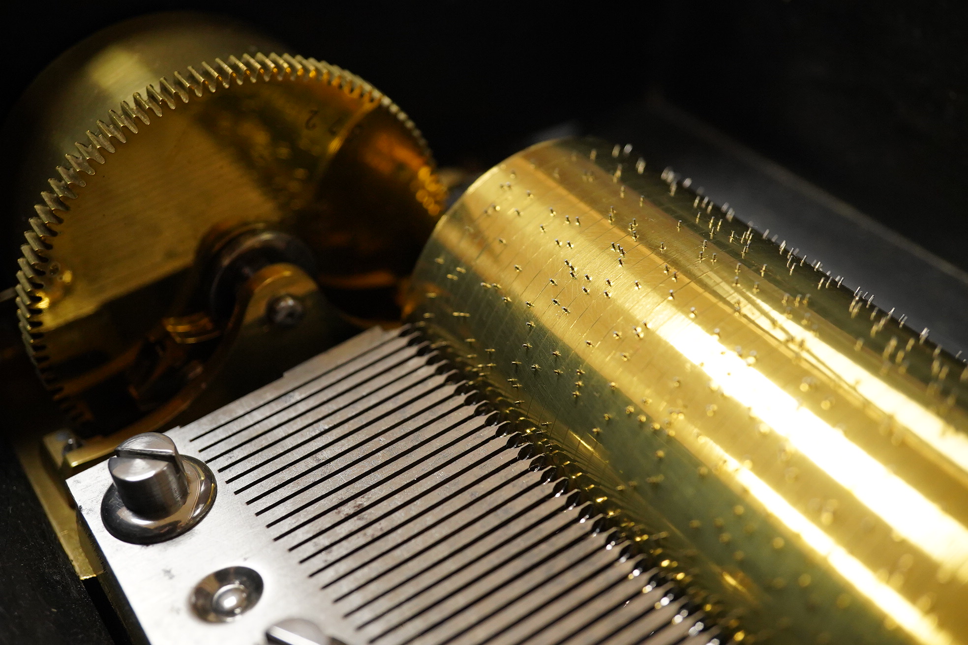 A late 19th century inlaid and ebonised rosewood Swiss cylinder music box by Nicole Freres, Geneve, and retailed by Alfred Hays, 4, Royal Exchange Buildings, complete with all teeth to the comb, cylinder 27.8cm long, the